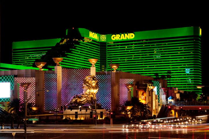 A photograph  of MGM Grand astatine  nighttime  lit up   successful  green. 